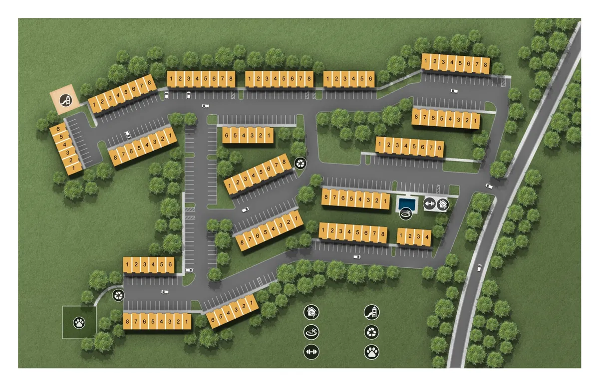 A wide exterior shot showing ample parking areas adjacent to the property’s layout, surrounded by green spaces. The image conveys open access, multiple entry points, and a community-oriented environment. The surrounding landscaping and visible parking spots emphasize practicality and comfort.